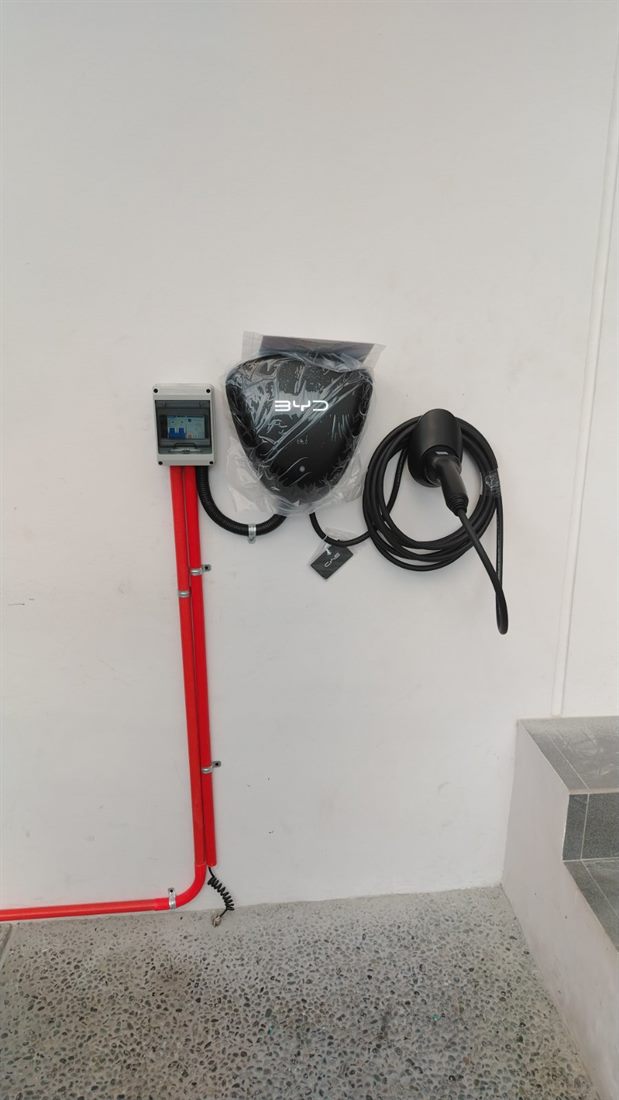 Surface conduit and cable routing for a BYD wall charger installation