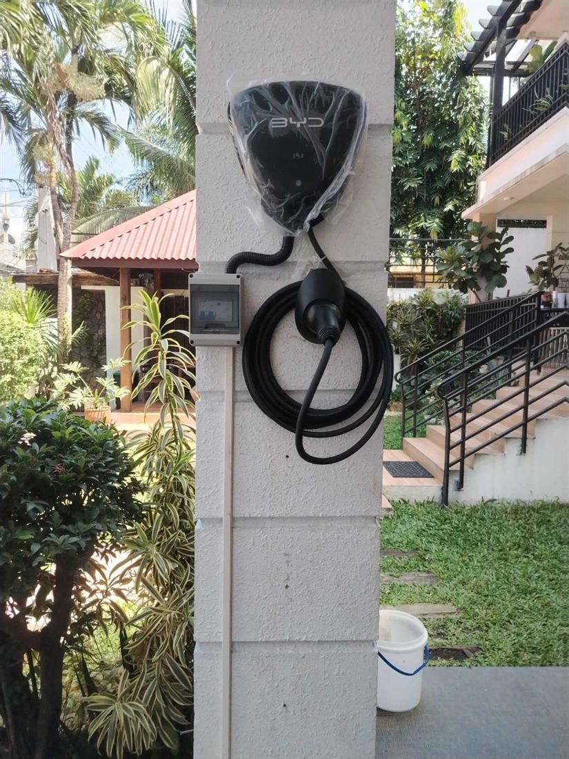 BYD wall charger installed at an outdoor residential location